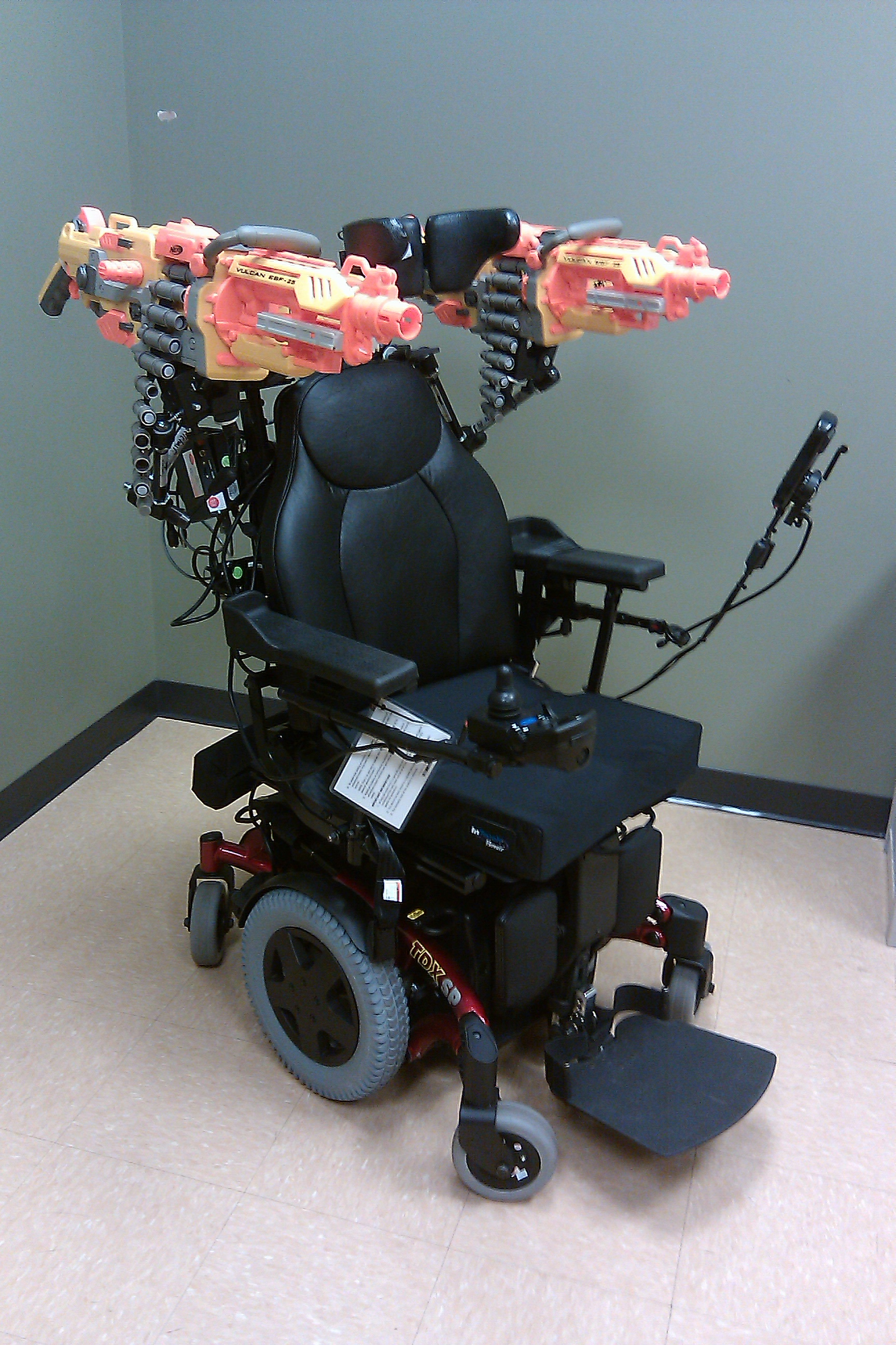 Wheelchair with Nerf machineguns mounted