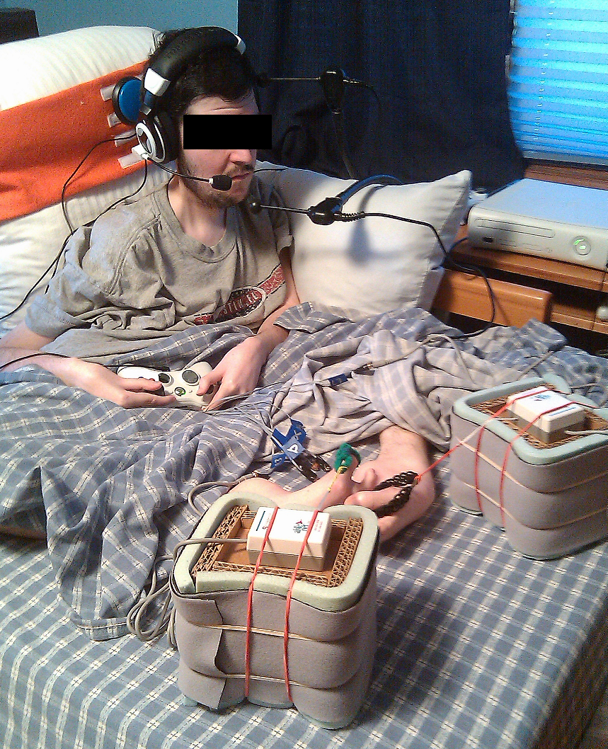 The user with his Xbox 360 controller and various switches